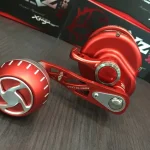 XZOGA * TXZ REEL TX-S 31PG - LEFT - red Beperkte Voorraad